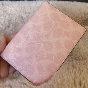 coach powder pink passport card case in signature canvas